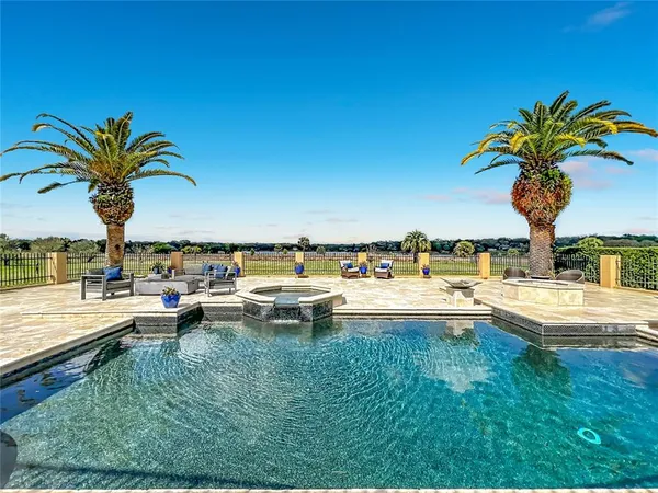 a view of a swimming pool and lounge chair