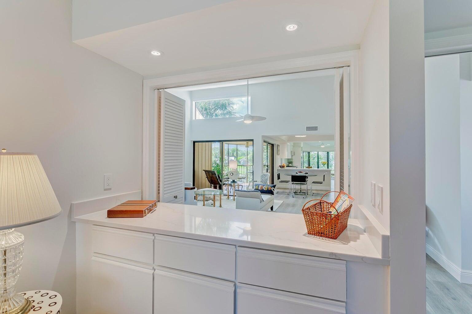 17053 Waterbend Drive, Unit 231 Jupiter, FL 33477 - Photo 14 of 26 a bathroom with a sink and a mirror