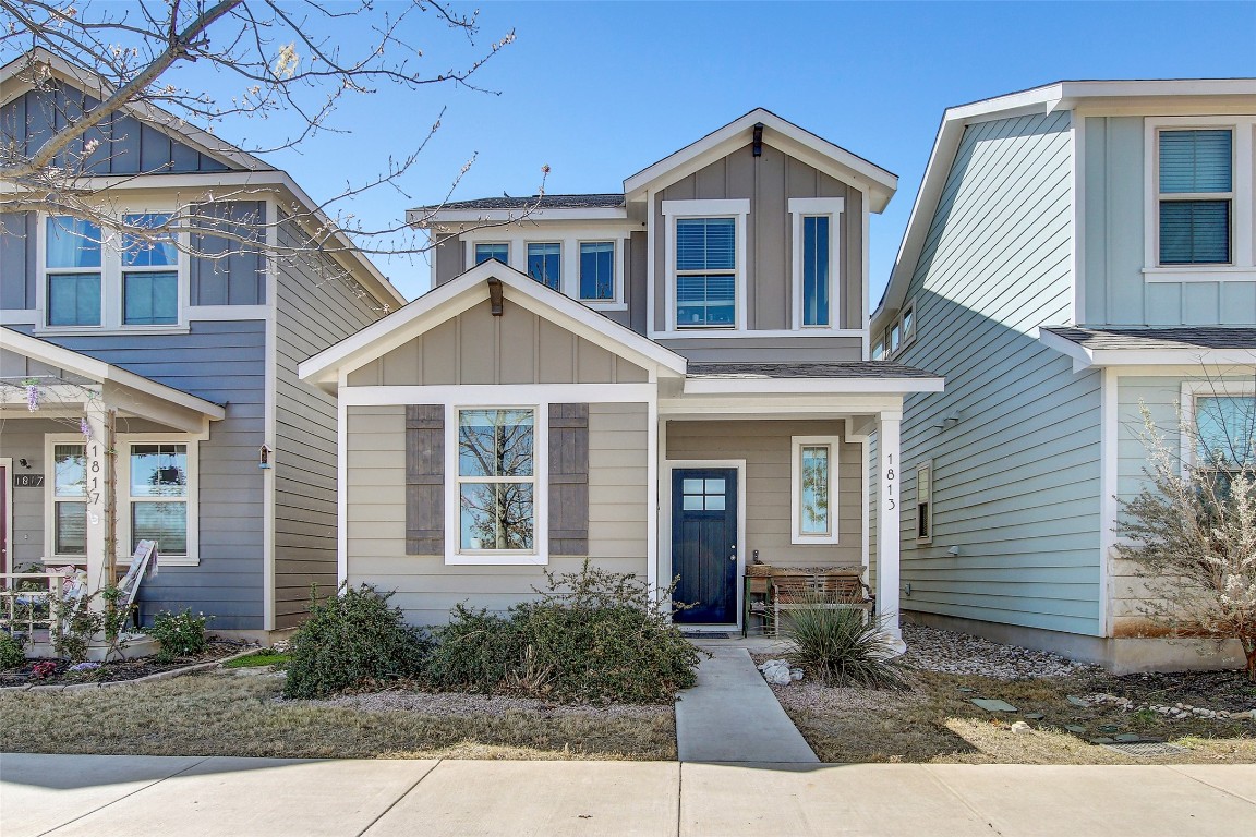 1813 Artesian Spgs Crossing Leander, TX 78641 - Photo 1 of 1 a front view of a house with garden