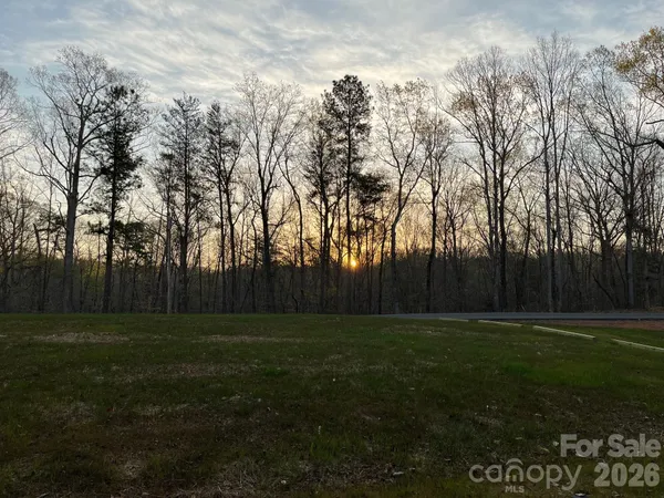 a bedroom with furniture and a large window