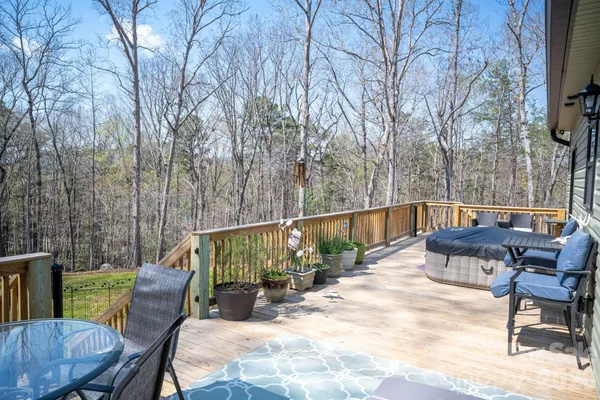 a view of a wooden deck with trees