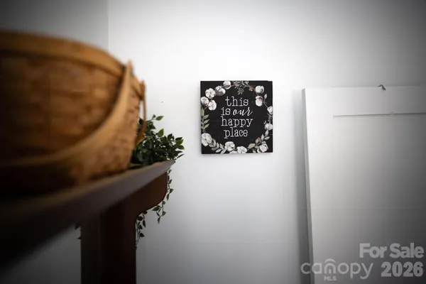 a bedroom with a bed a flat screen tv and dresser