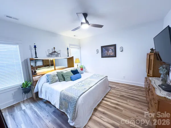 a bedroom with a bed and a walk in closet