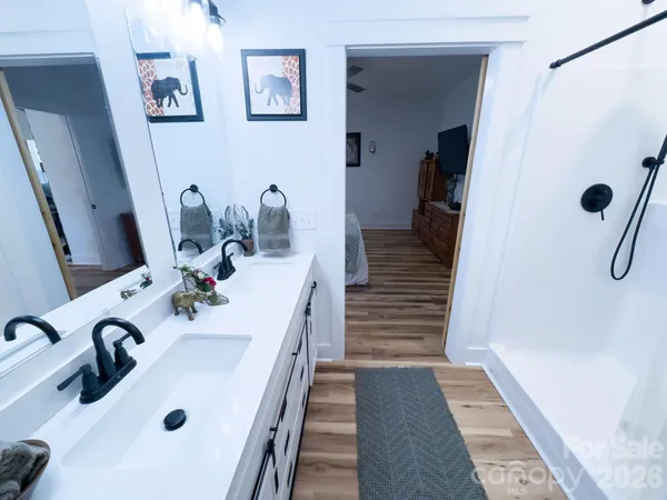 a bathroom with a double vanity sink and a mirror