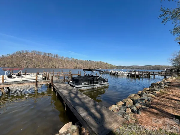 a front view of a house with a yard table and chairs