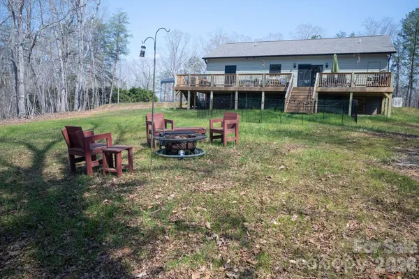 a view of a house with backyard porch and sitting area