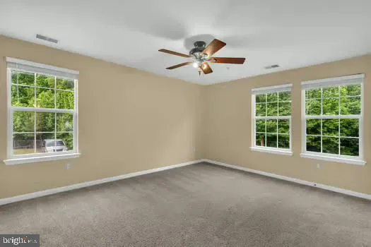 a view of empty room with windows