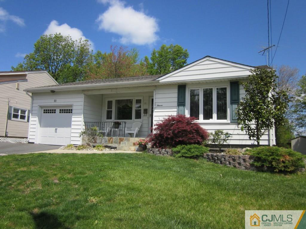 11 Ferris Road Edison, NJ 08817 - Photo 1 of 13 a front view of a house with a yard and porch