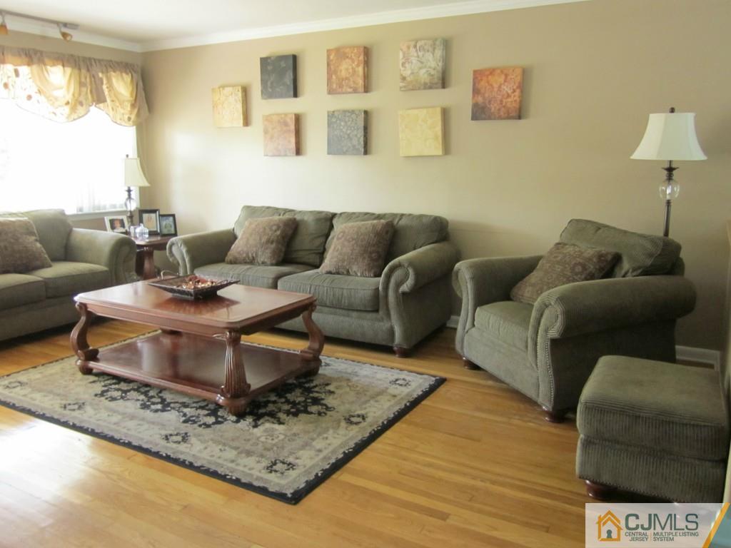 11 Ferris Road Edison, NJ 08817 - Photo 2 of 13 a living room with furniture and a rug