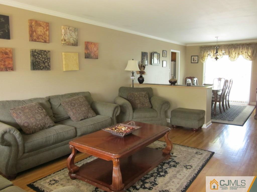 11 Ferris Road Edison, NJ 08817 - Photo 4 of 13 a living room with furniture a rug and a large window