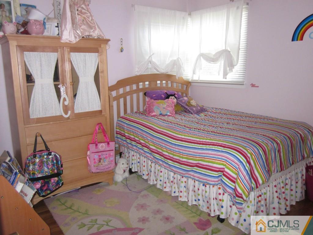 11 Ferris Road Edison, NJ 08817 - Photo 8 of 13 a bedroom with a bed and window