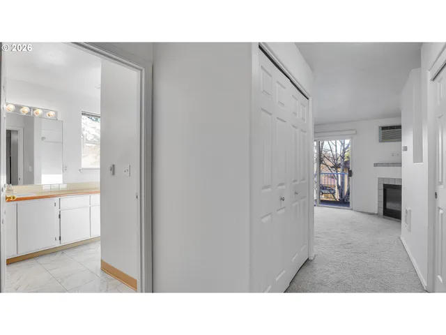 a open living room with furniture and a large window