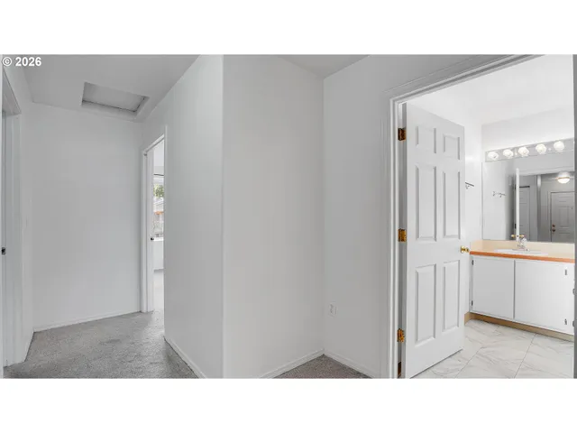 a open living room with washer and dryer