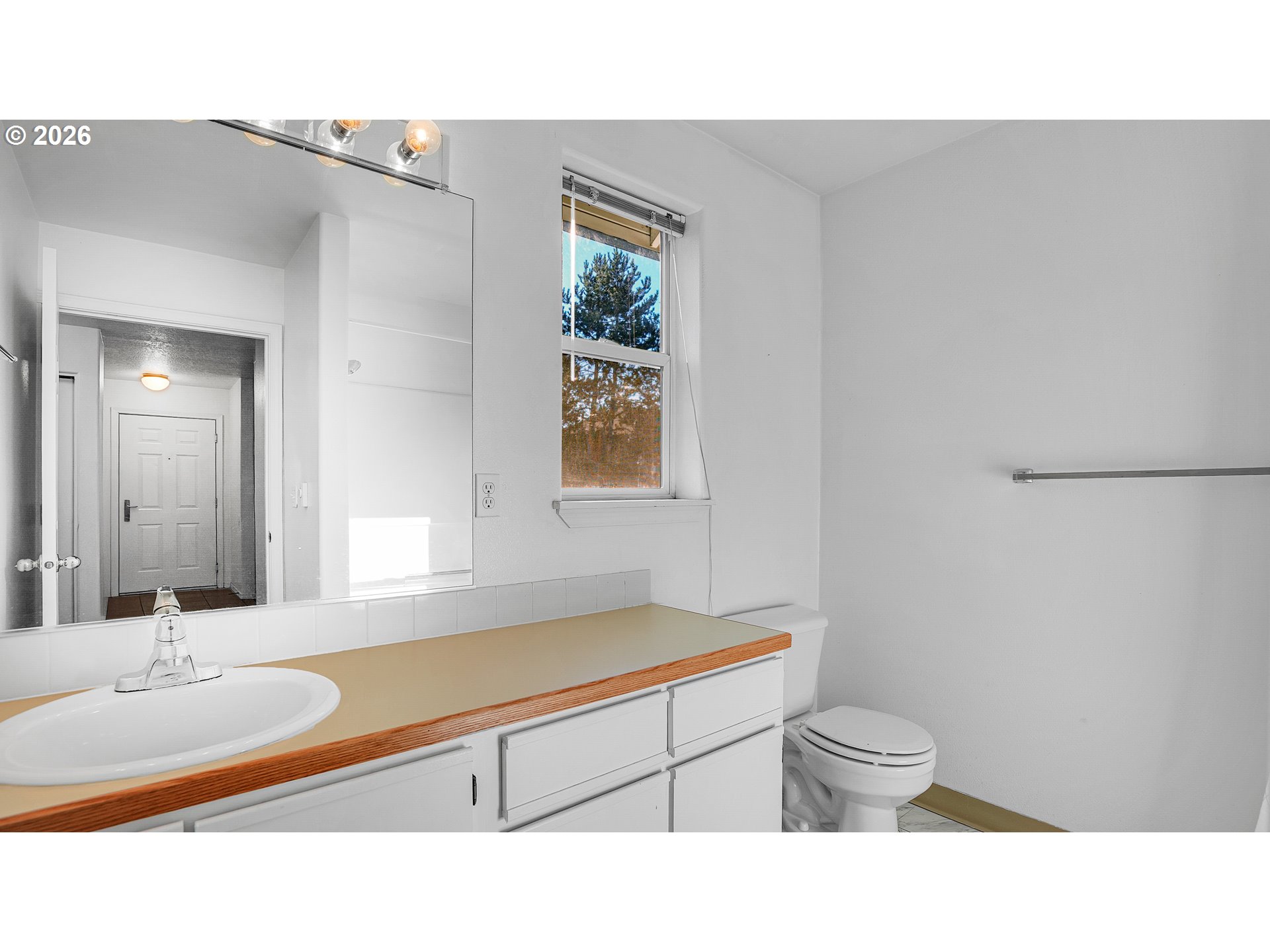 4614 West Powell Boulevard, Unit 258 Gresham, OR 97030 - Photo 25 of 43 a bathroom with a sink a toilet and mirror