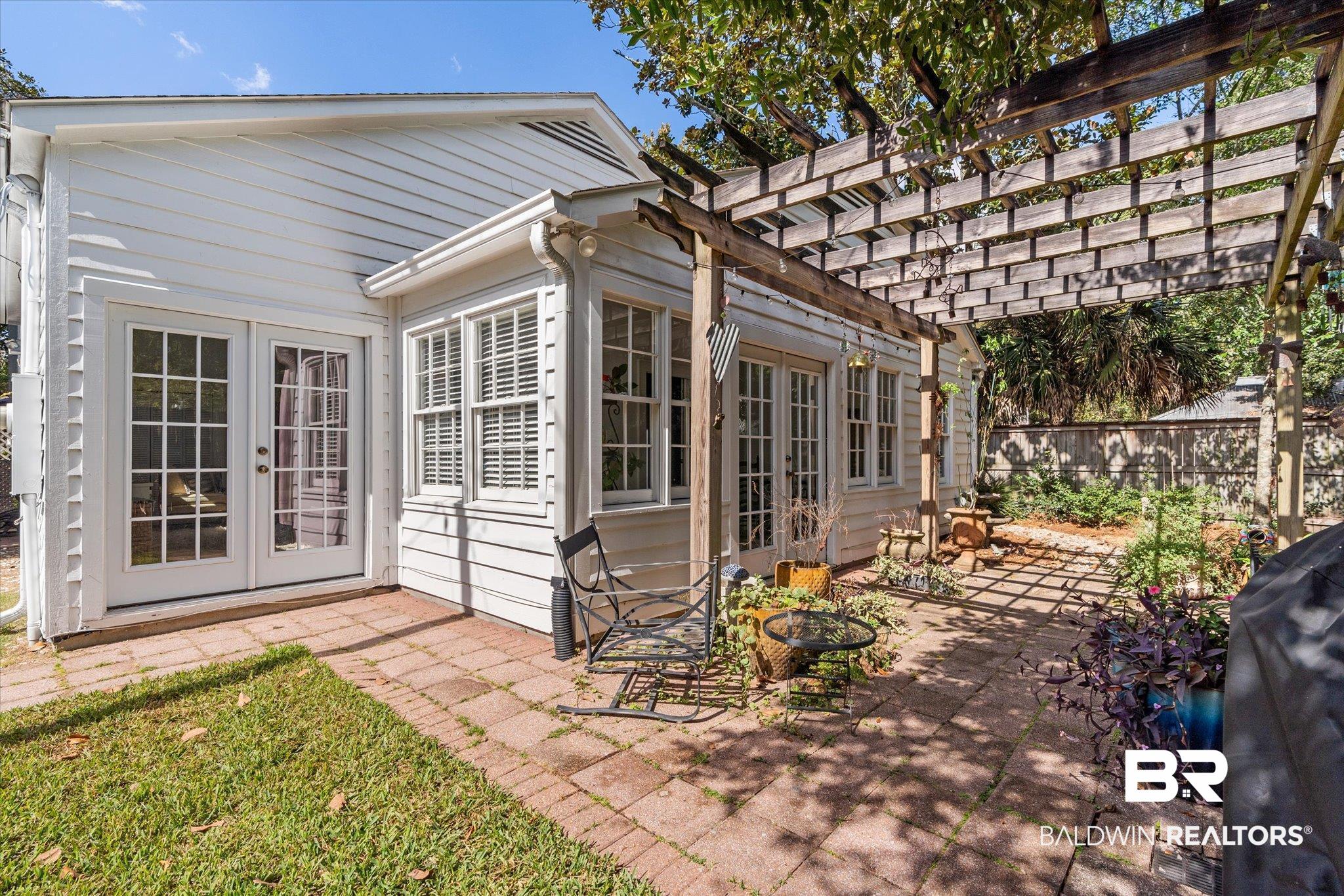 202 Woodlands Avenue Mobile, AL 36607 - Photo 35 of 53 Exterior space featuring a patio, a pergola, and french doors