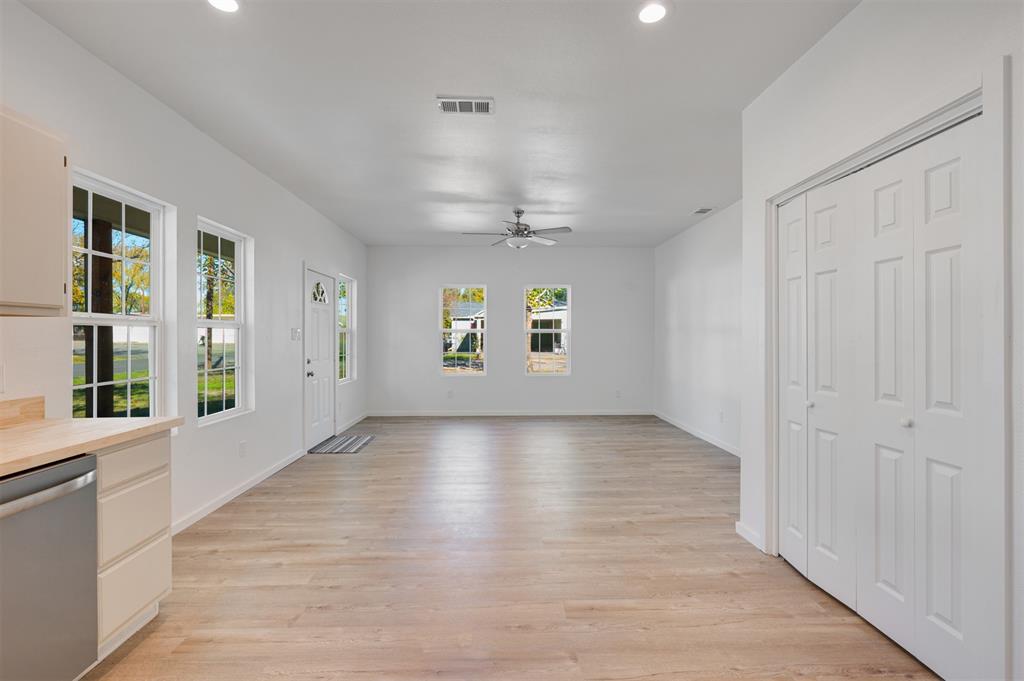 501 Southeast 1st Street Cooper, TX 75432 - Photo 15 of 29 wooden floor in an empty room with a window