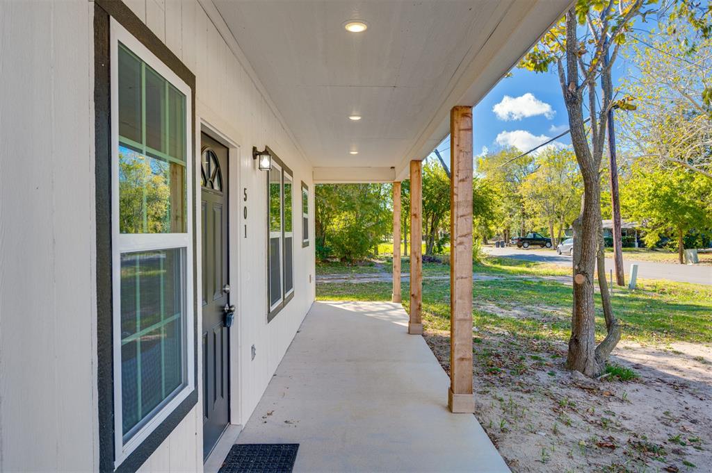 501 Southeast 1st Street Cooper, TX 75432 - Photo 4 of 29 a view of swimming pool with porch and garden
