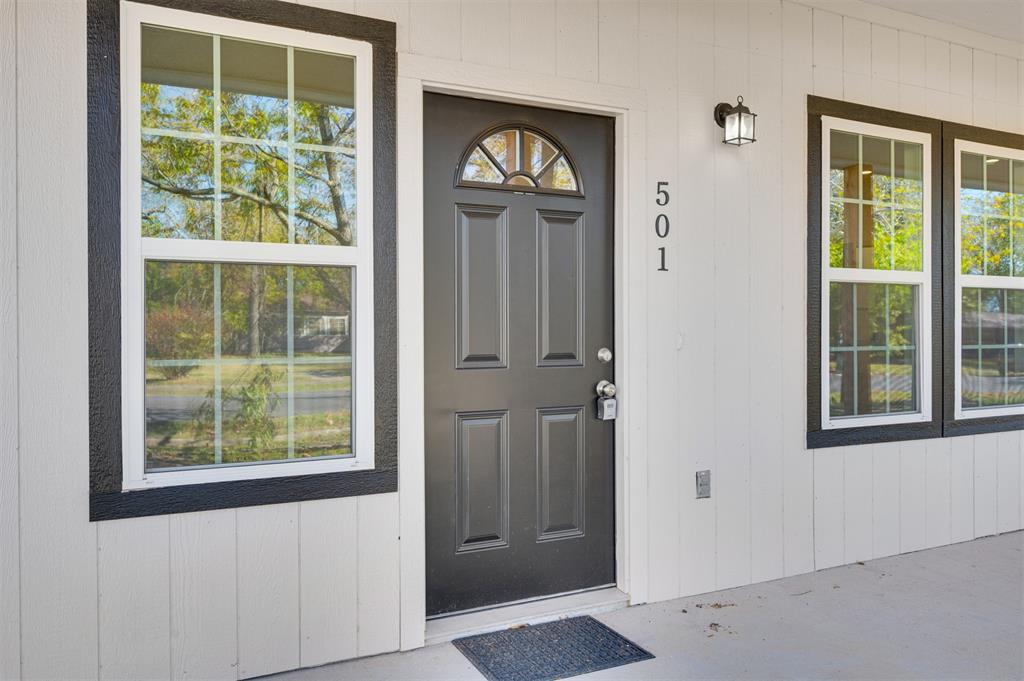 501 Southeast 1st Street Cooper, TX 75432 - Photo 5 of 29 an empty room with windows and closet