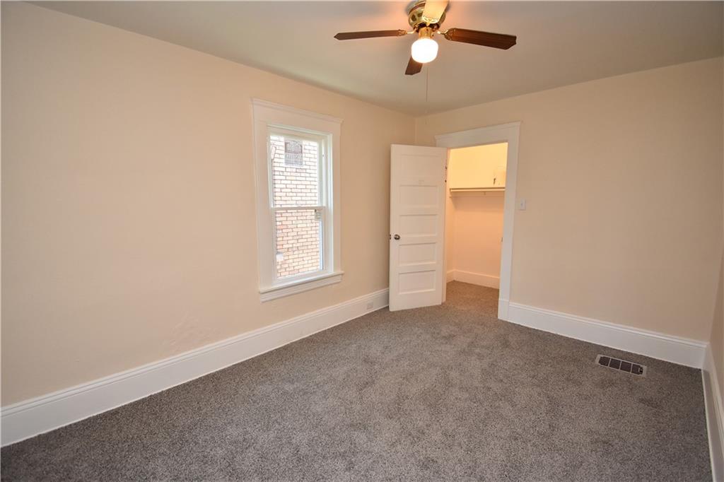 11 Frazier Avenue McKees Rocks, PA 15136 - Photo 13 of 22 an empty room with windows and fan