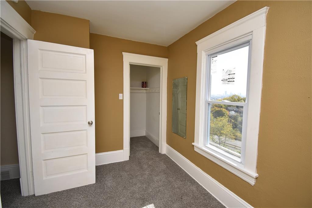 11 Frazier Avenue McKees Rocks, PA 15136 - Photo 14 of 22 an empty room with windows and closet