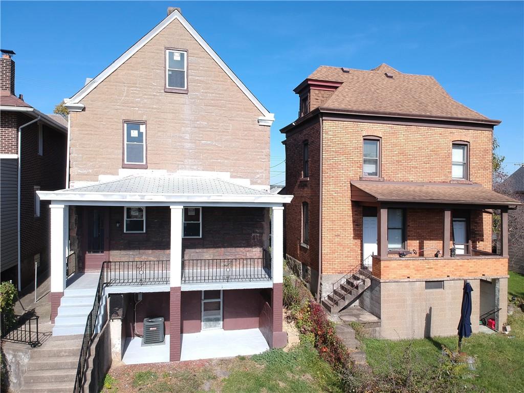11 Frazier Avenue McKees Rocks, PA 15136 - Photo 2 of 22 a front view of a house with a yard