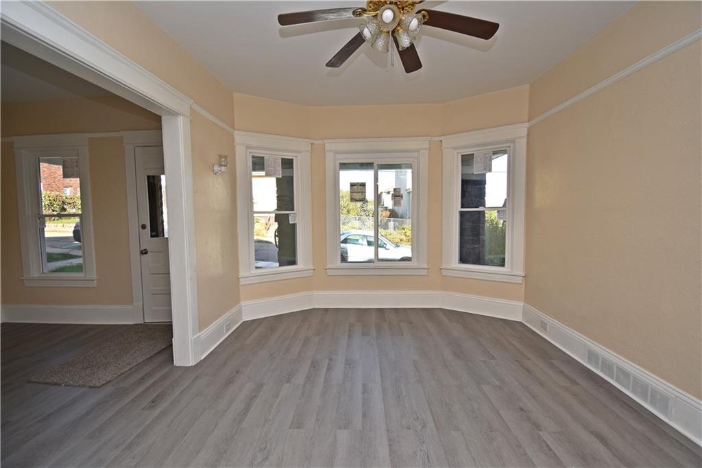 11 Frazier Avenue McKees Rocks, PA 15136 - Photo 6 of 22 a view of an empty room with wooden floor and a window