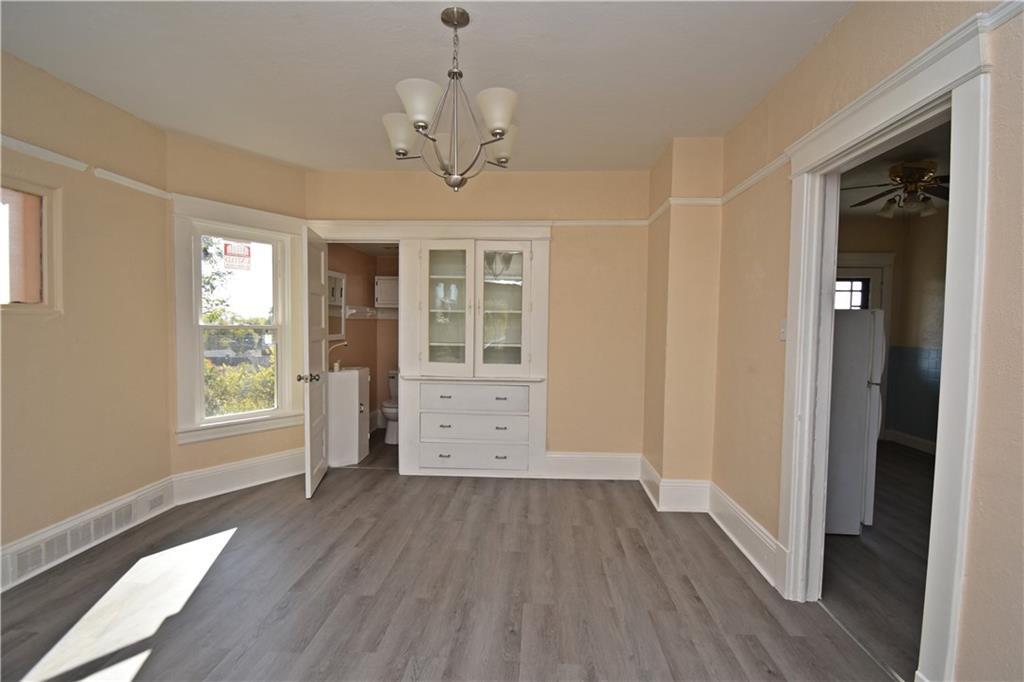 11 Frazier Avenue McKees Rocks, PA 15136 - Photo 8 of 22 a view of empty room with wooden floor and fan