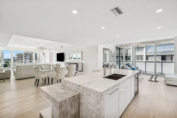 a kitchen with a sink cabinets and wooden floor