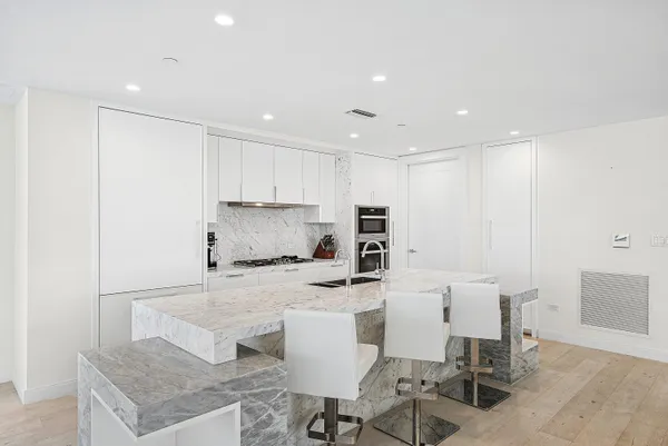 a kitchen with a stove and a refrigerator