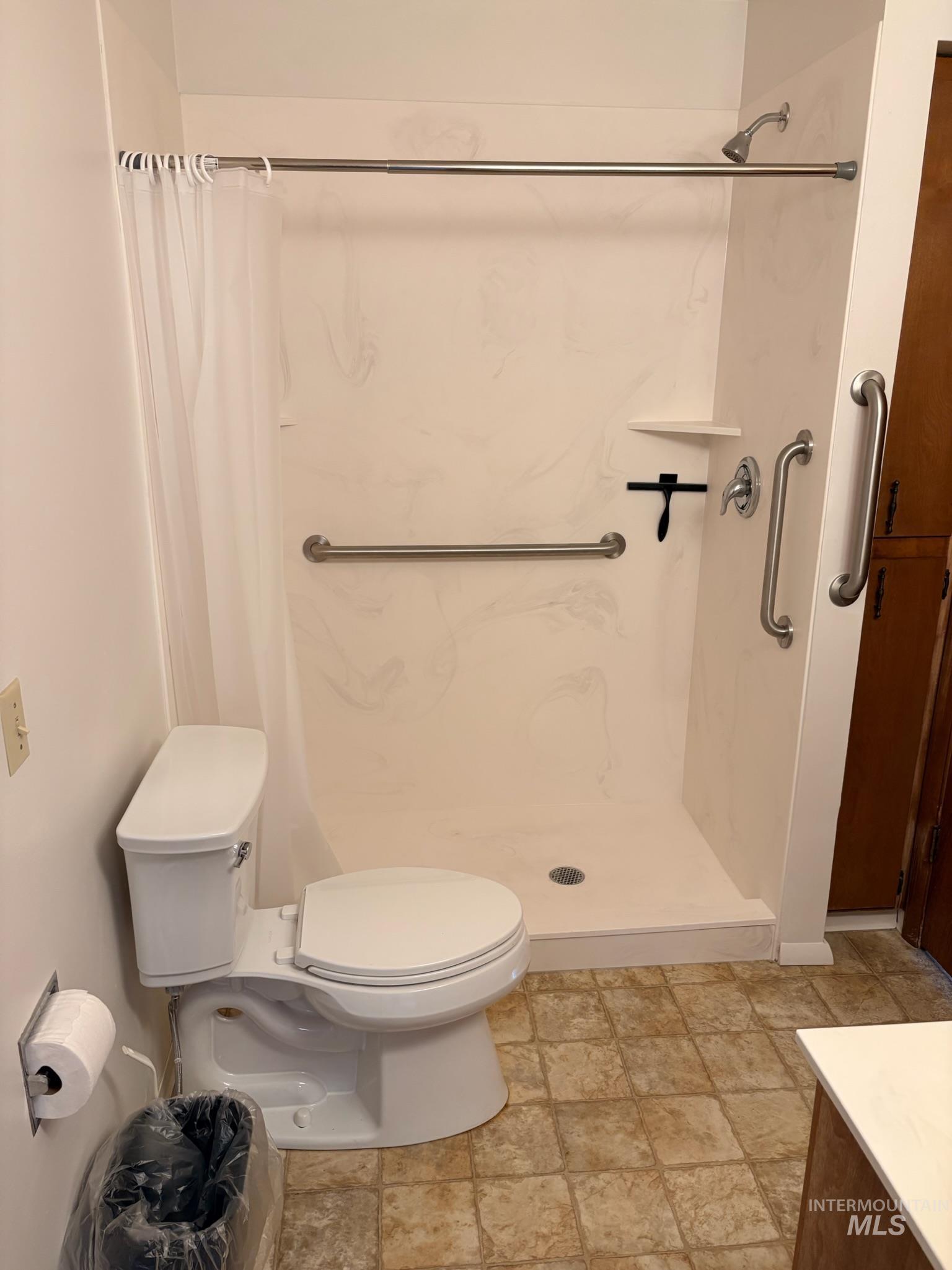 627 Southwest 3rd Street Fruitland, ID 83619 - Photo 19 of 35 Full bathroom featuring a shower stall and stone finish floors