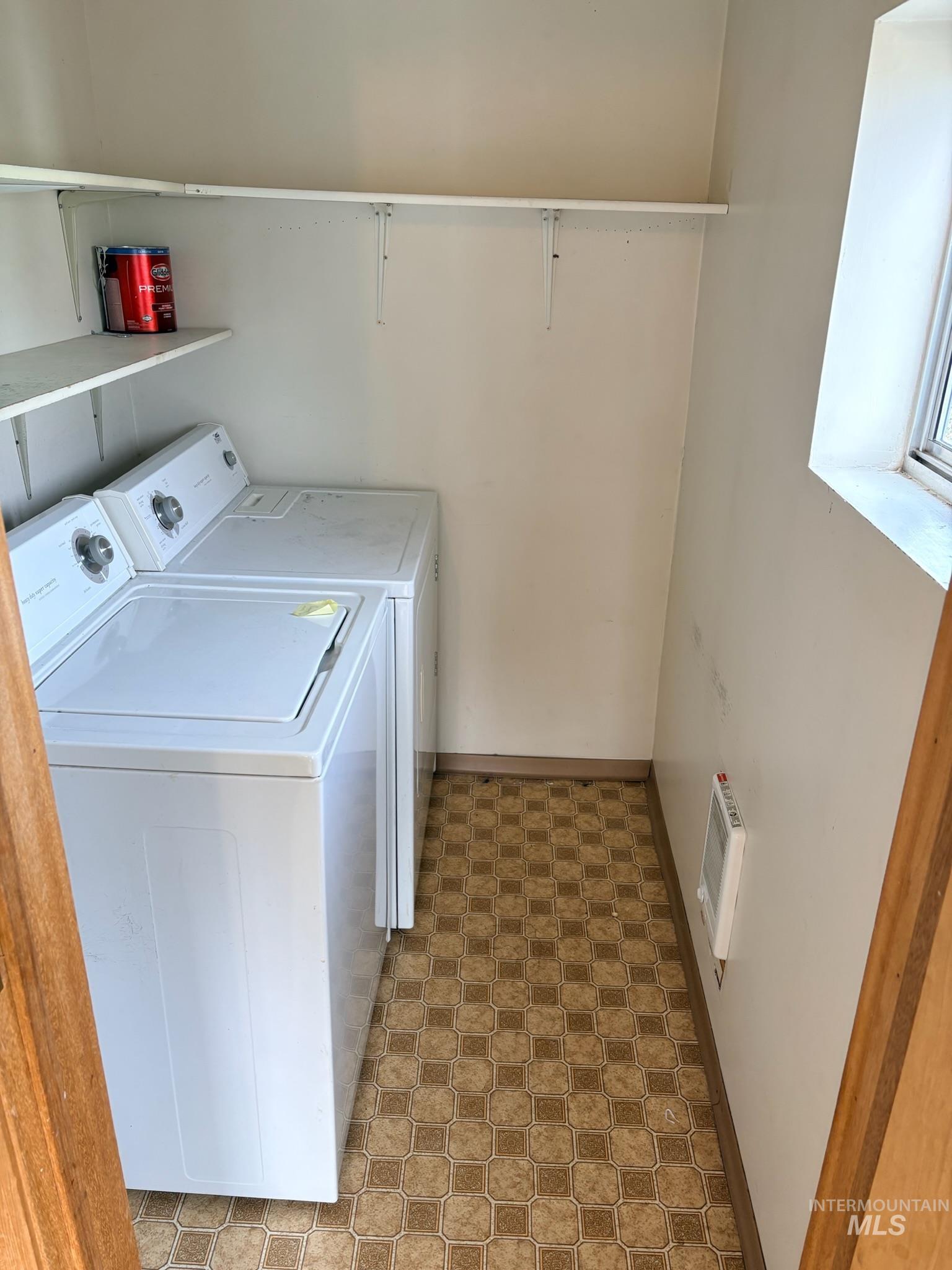 627 Southwest 3rd Street Fruitland, ID 83619 - Photo 26 of 35 Laundry room featuring separate washer and dryer, heating unit, and light floors