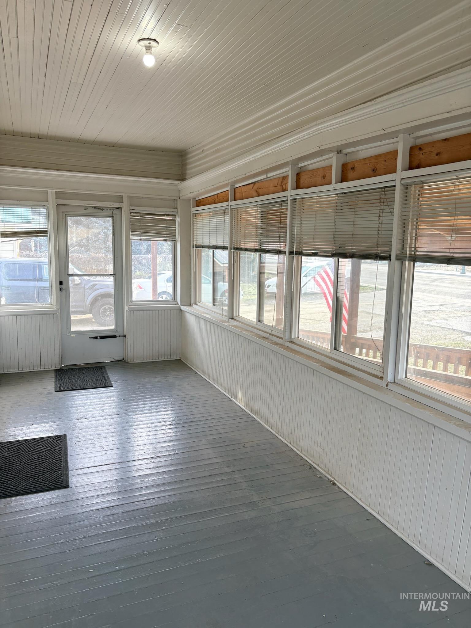 627 Southwest 3rd Street Fruitland, ID 83619 - Photo 4 of 35 Unfurnished sunroom with wood walls and wood ceiling