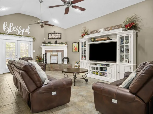 a living room with furniture and a flat screen tv
