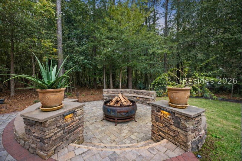 15 Little Pine Court Bluffton, SC 29910 - Photo 7 of 52 Grand Firepit area to enjoy outdoor living.