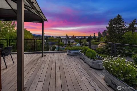 a view of balcony with deck and wooden floor