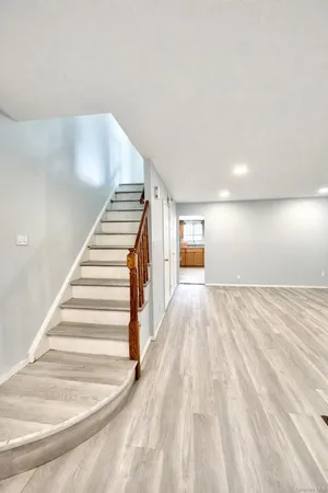 a view of a hallway with stairs