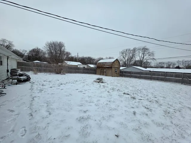 a view of a backyard of the house