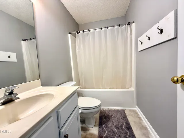 a swimming pool with trees in the background