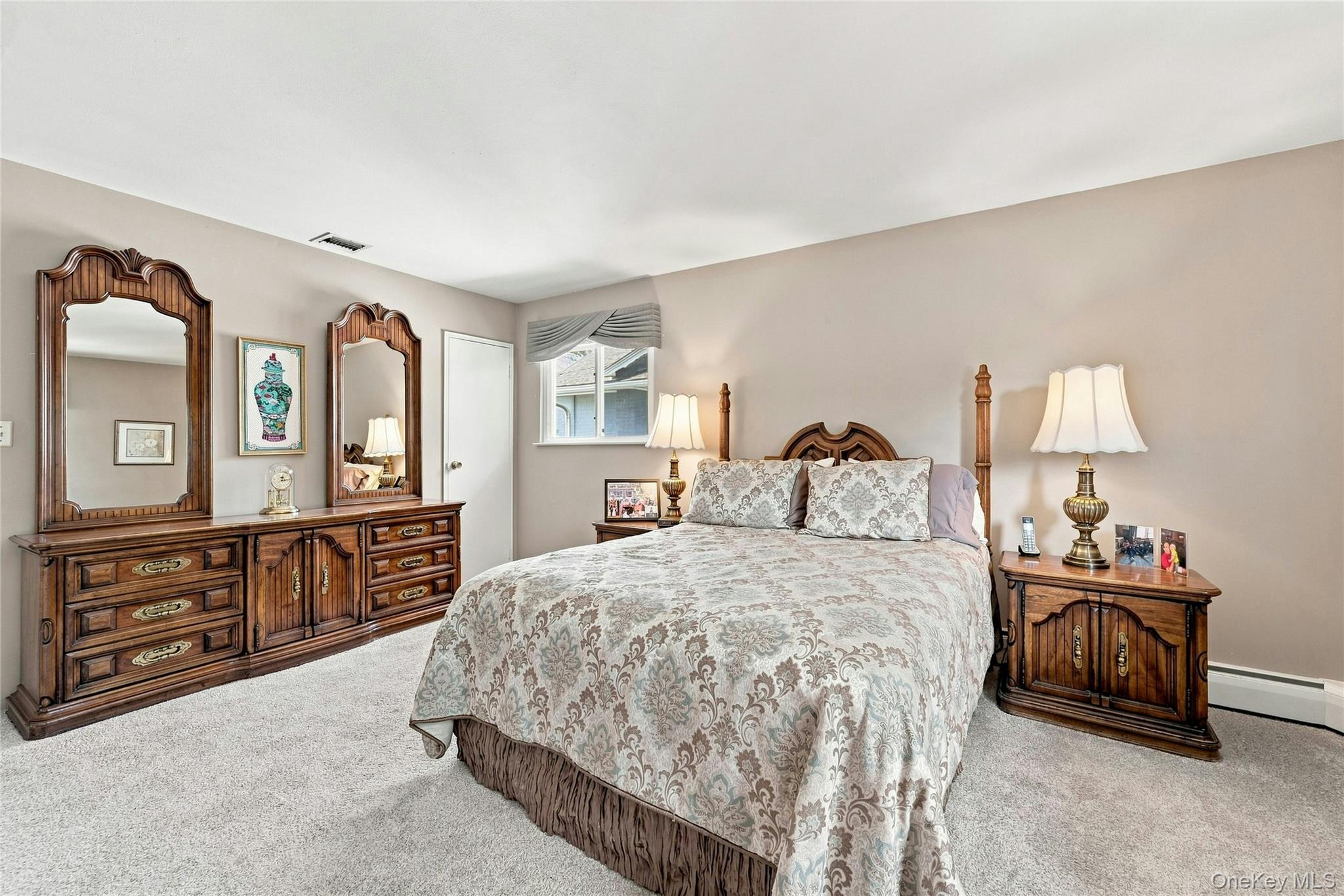 3165 Clubhouse Road Merrick, NY 11566 - Photo 27 of 45 Wall-to-wall carpeting and neutral wall tones