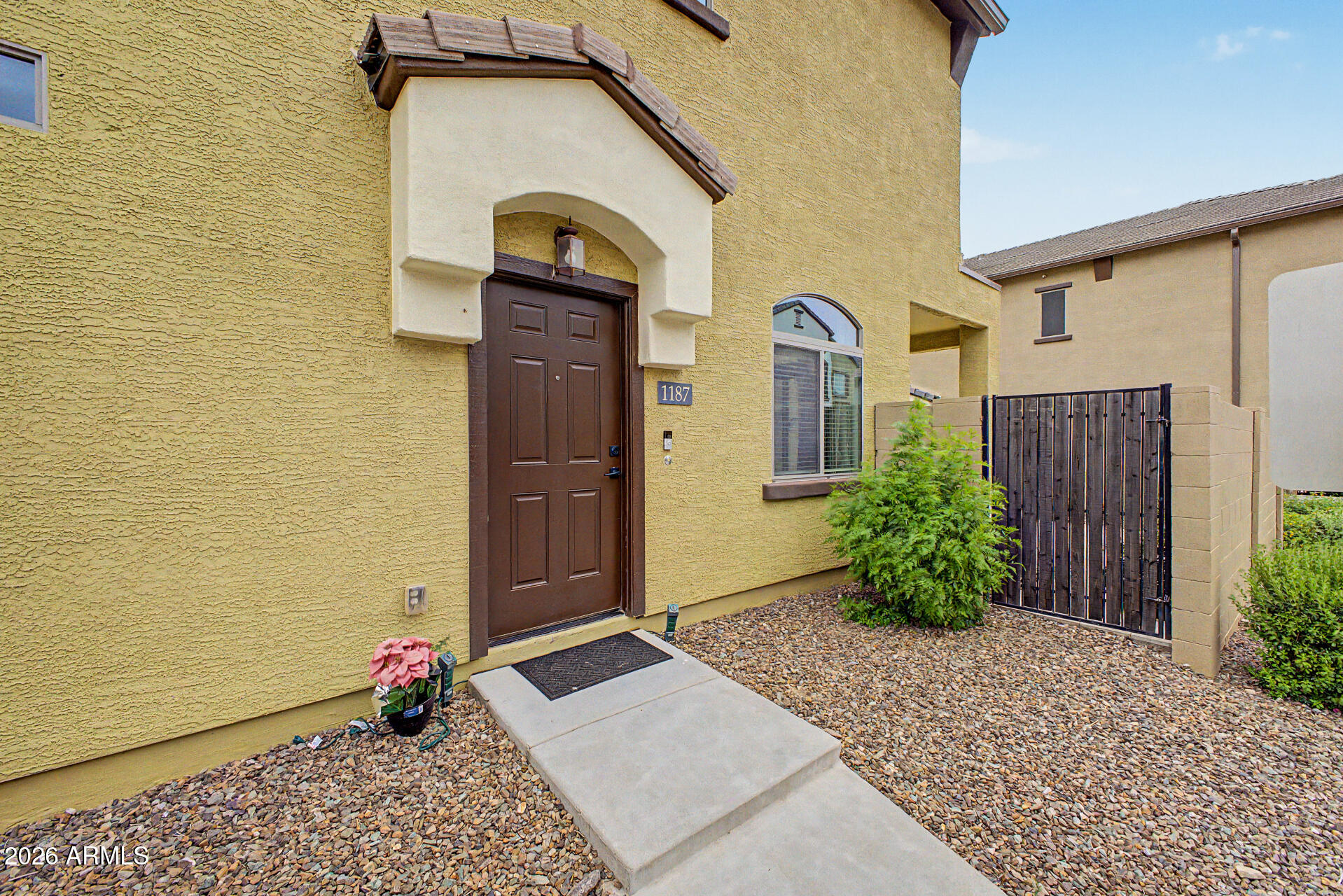 2725 East Mine Creek Road, Unit 1187 Phoenix, AZ 85024 - Photo 1 of 37 a front view of a house with plants
