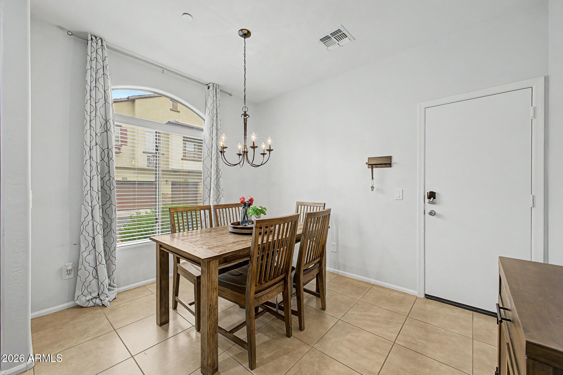 2725 East Mine Creek Road, Unit 1187 Phoenix, AZ 85024 - Photo 11 of 37 a view of a dining room with furniture window and outside view