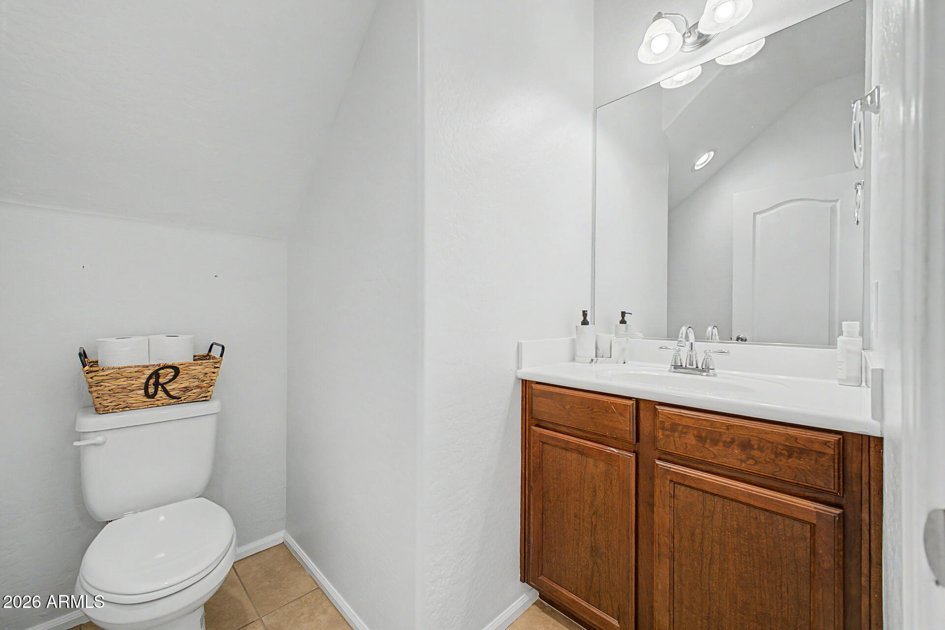 2725 East Mine Creek Road, Unit 1187 Phoenix, AZ 85024 - Photo 12 of 37 a bathroom with a toilet a sink and mirror