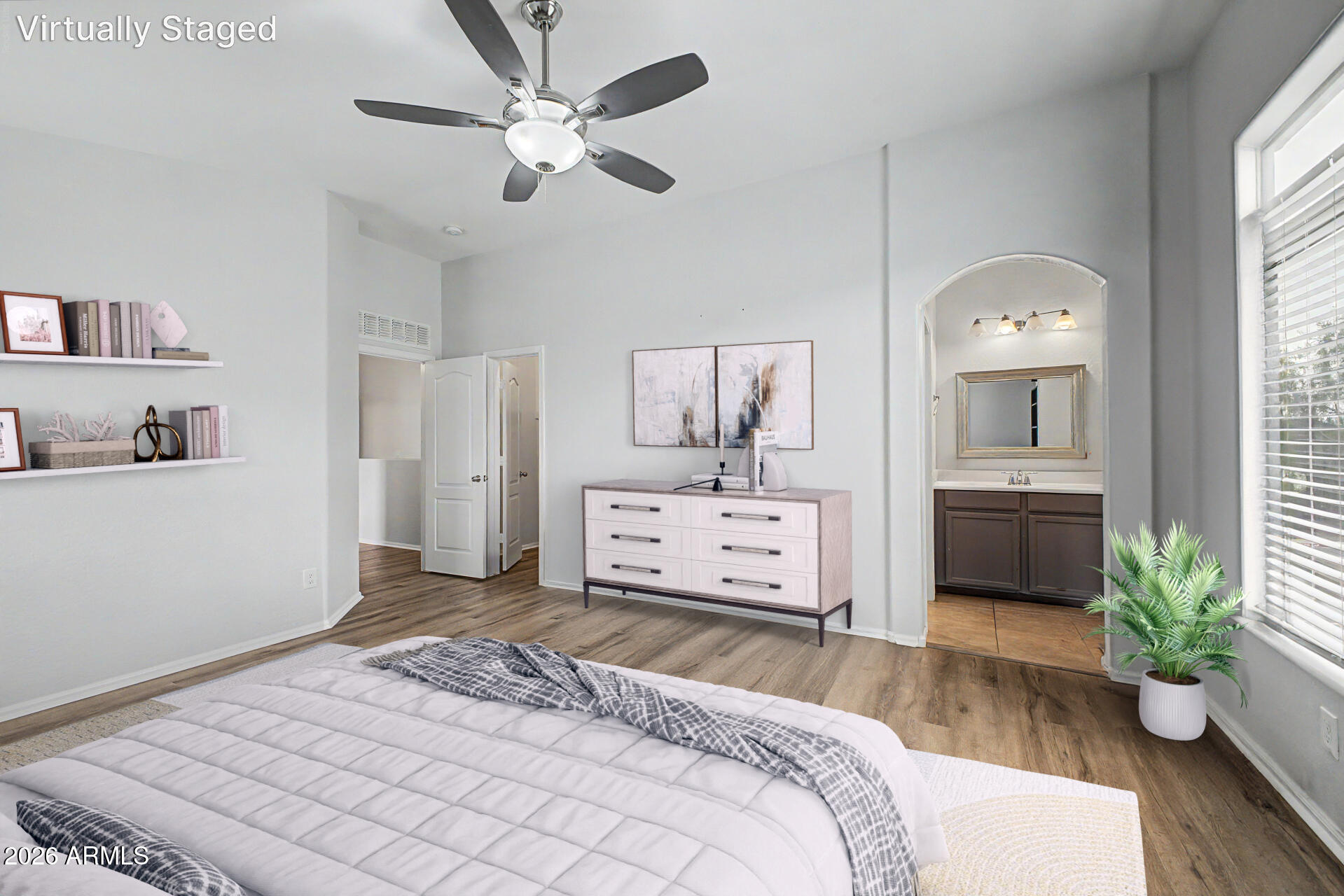 2725 East Mine Creek Road, Unit 1187 Phoenix, AZ 85024 - Photo 15 of 37 a bedroom with a bed and a couch