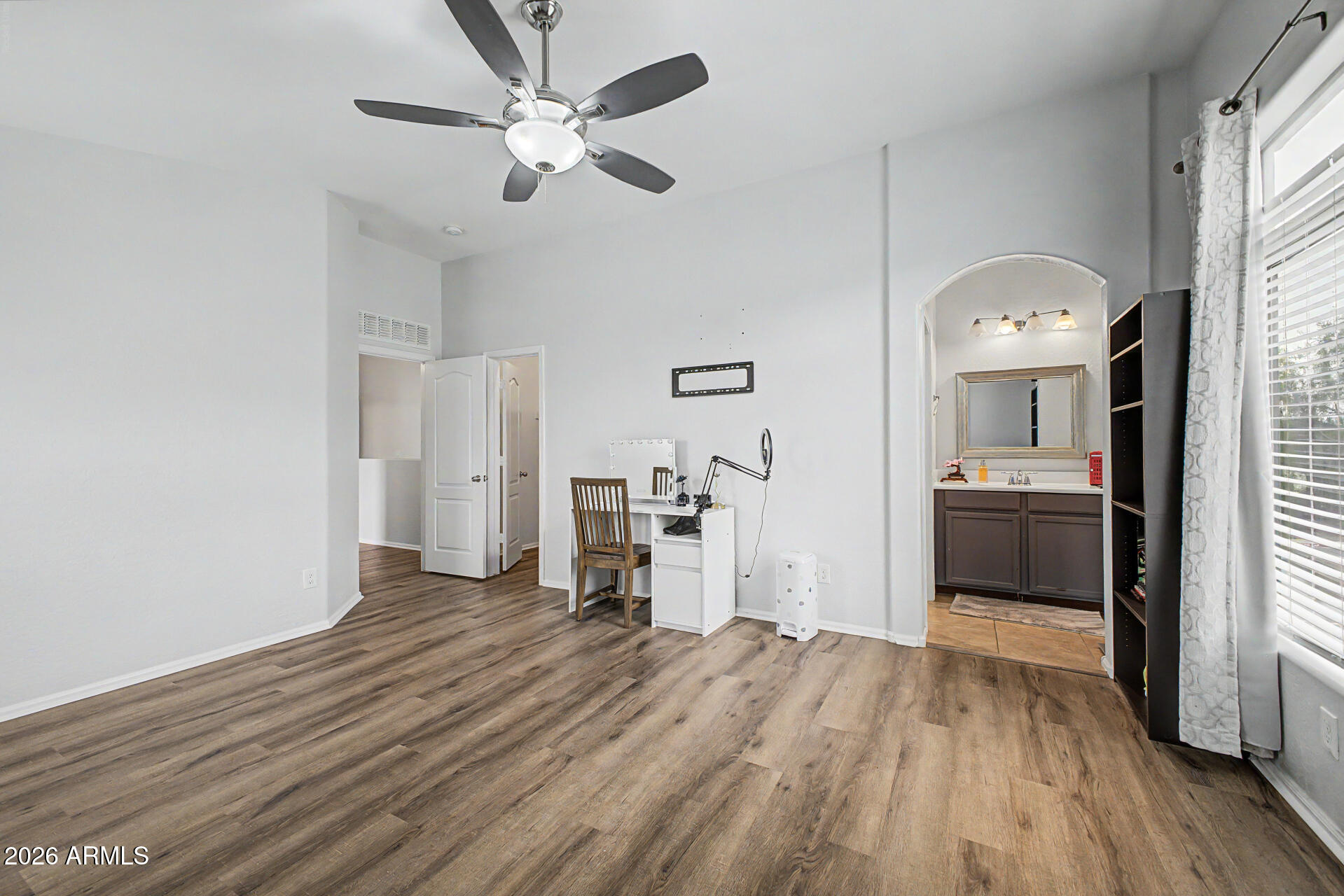 2725 East Mine Creek Road, Unit 1187 Phoenix, AZ 85024 - Photo 16 of 37 a view of a kitchen with a dishwasher cabinets and wooden floor