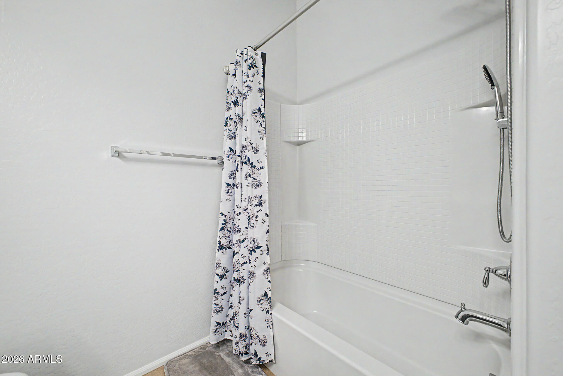 2725 East Mine Creek Road, Unit 1187 Phoenix, AZ 85024 - Photo 22 of 37 a bathroom with a shower curtain