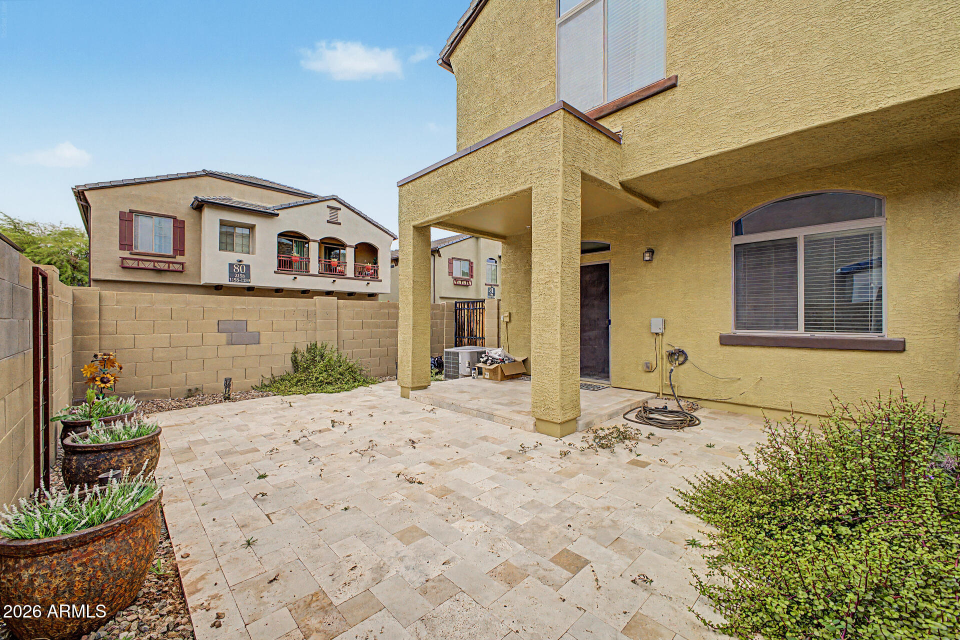 2725 East Mine Creek Road, Unit 1187 Phoenix, AZ 85024 - Photo 25 of 37 a front view of a house with a yard
