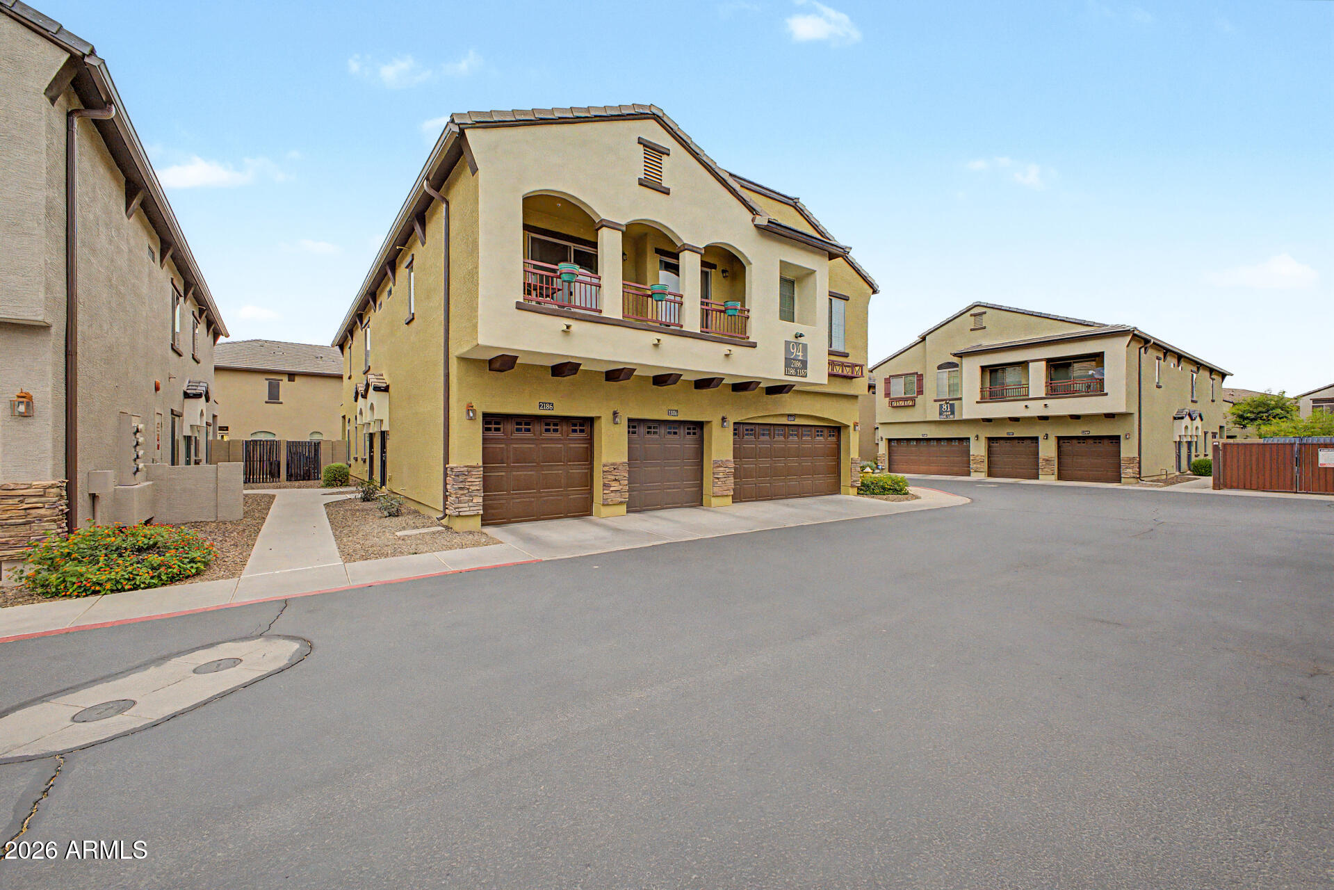 2725 East Mine Creek Road, Unit 1187 Phoenix, AZ 85024 - Photo 28 of 37 a front view of a house with a garden