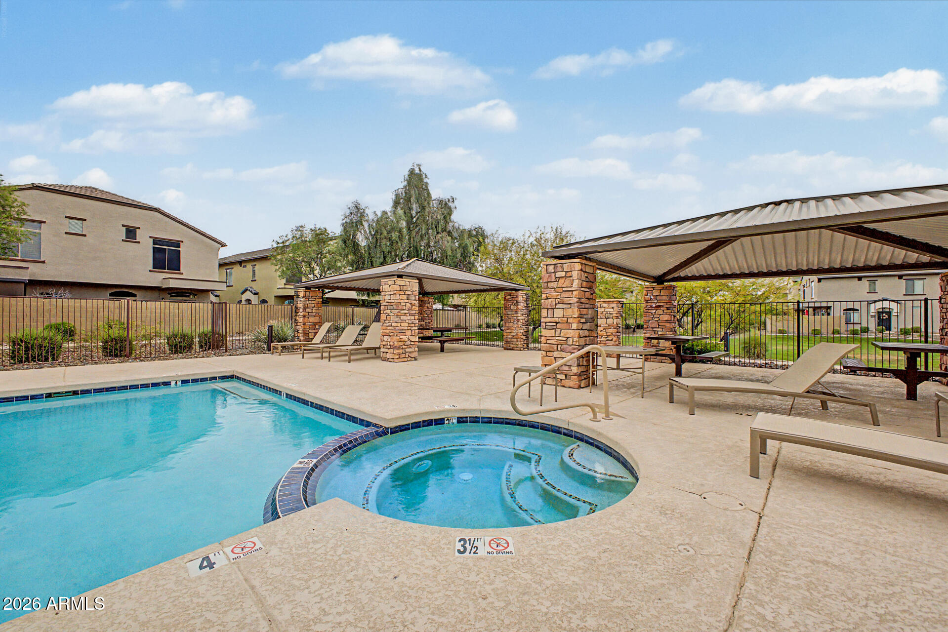 2725 East Mine Creek Road, Unit 1187 Phoenix, AZ 85024 - Photo 33 of 37 a view of a swimming pool with lawn chairs