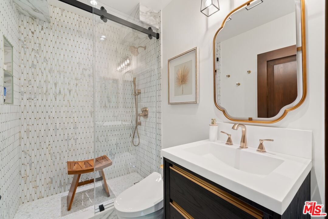 2612 Montana Avenue, Unit 1 Santa Monica, CA 90403 - Photo 13 of 27 a bathroom with a sink and a mirror