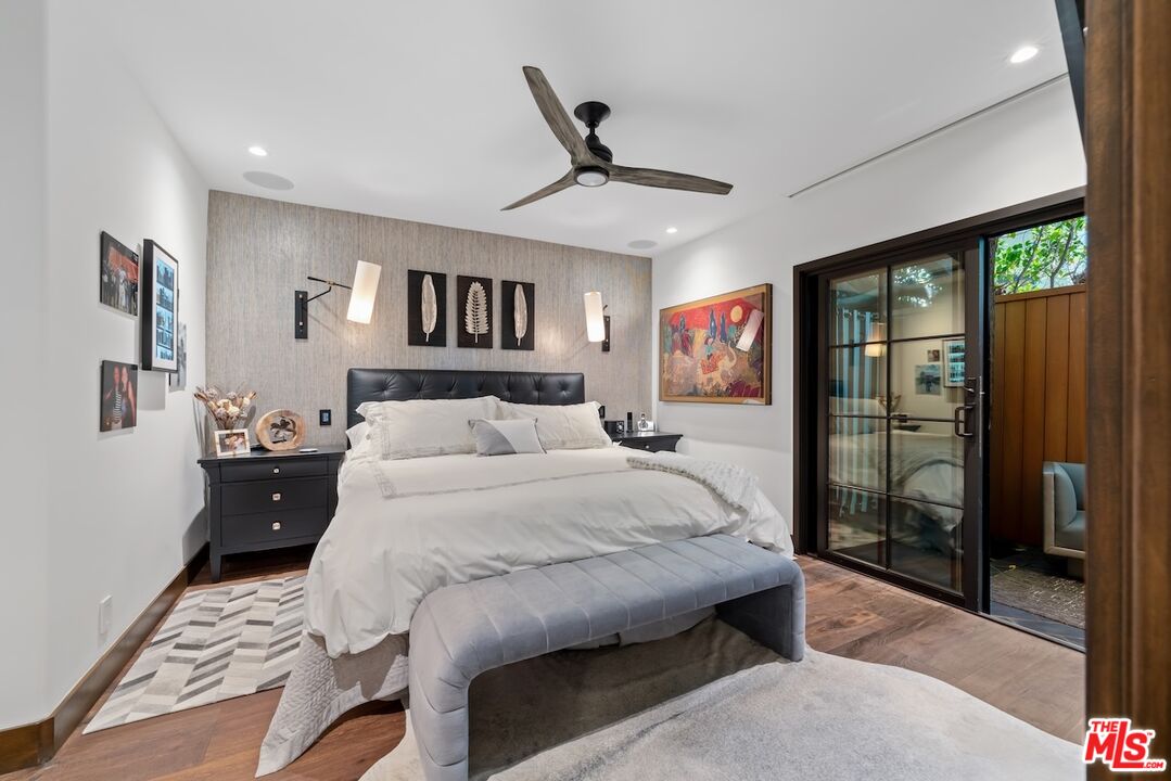 2612 Montana Avenue, Unit 1 Santa Monica, CA 90403 - Photo 14 of 27 a bedroom with a large bed and a chandelier